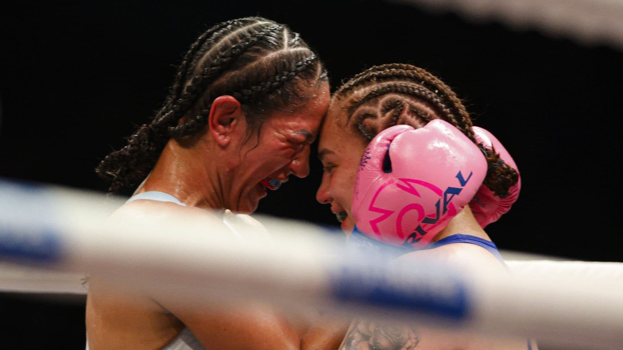 Reina Tellez and Amanda Serrano embrace following their fight