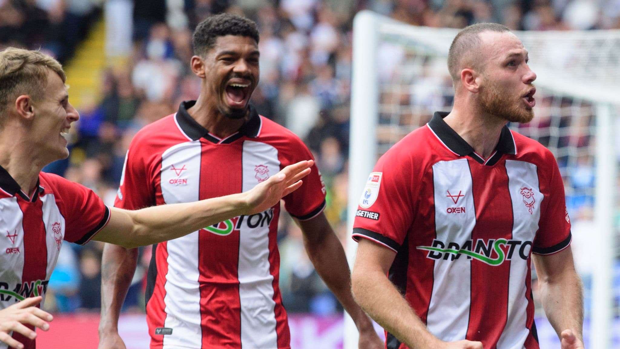 Ben House of Lincoln City celebrates scoring the match-winning goal