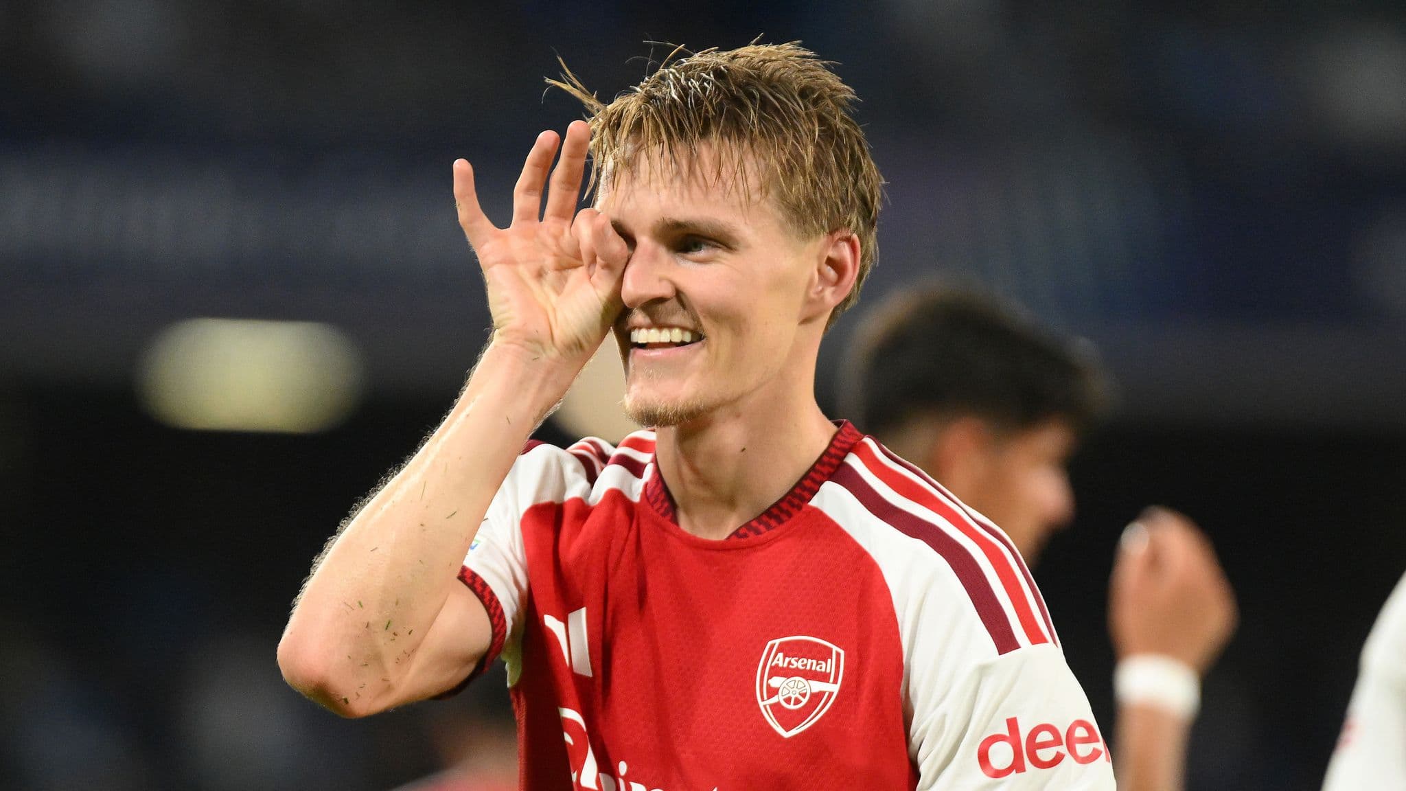 Martin Odegaard celebrates scoring against Napoli