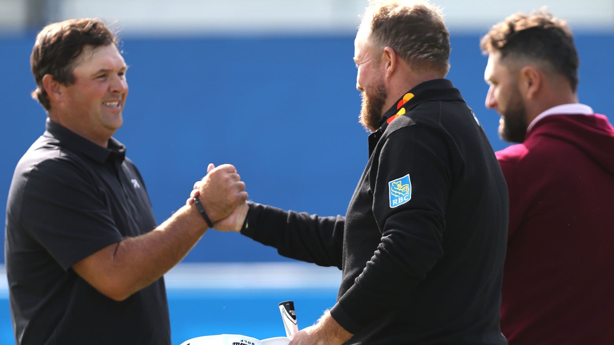 Lowry played alongside Patrick Reed (left) and Jon Rahm